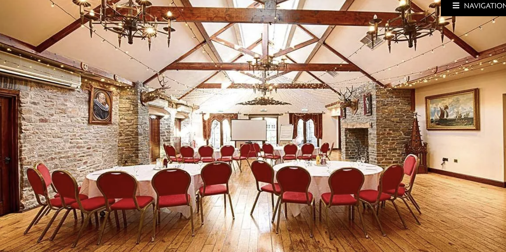 Miskin Manor Hotel event space with round tables, ideal for meetings and celebrations.