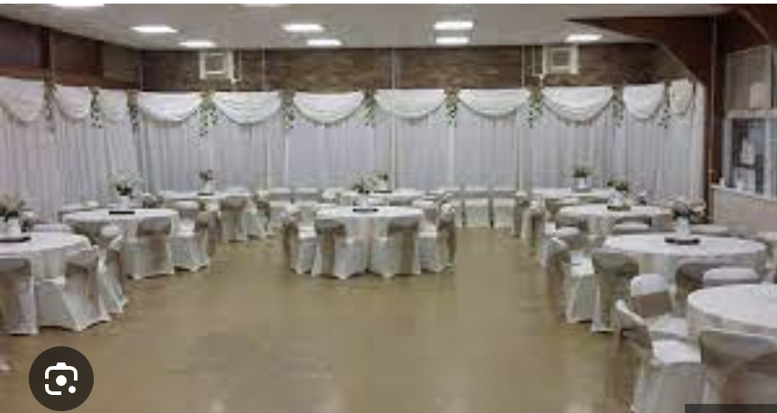 Elegant event space in EastendHomes with round tables, perfect for weddings and gatherings.