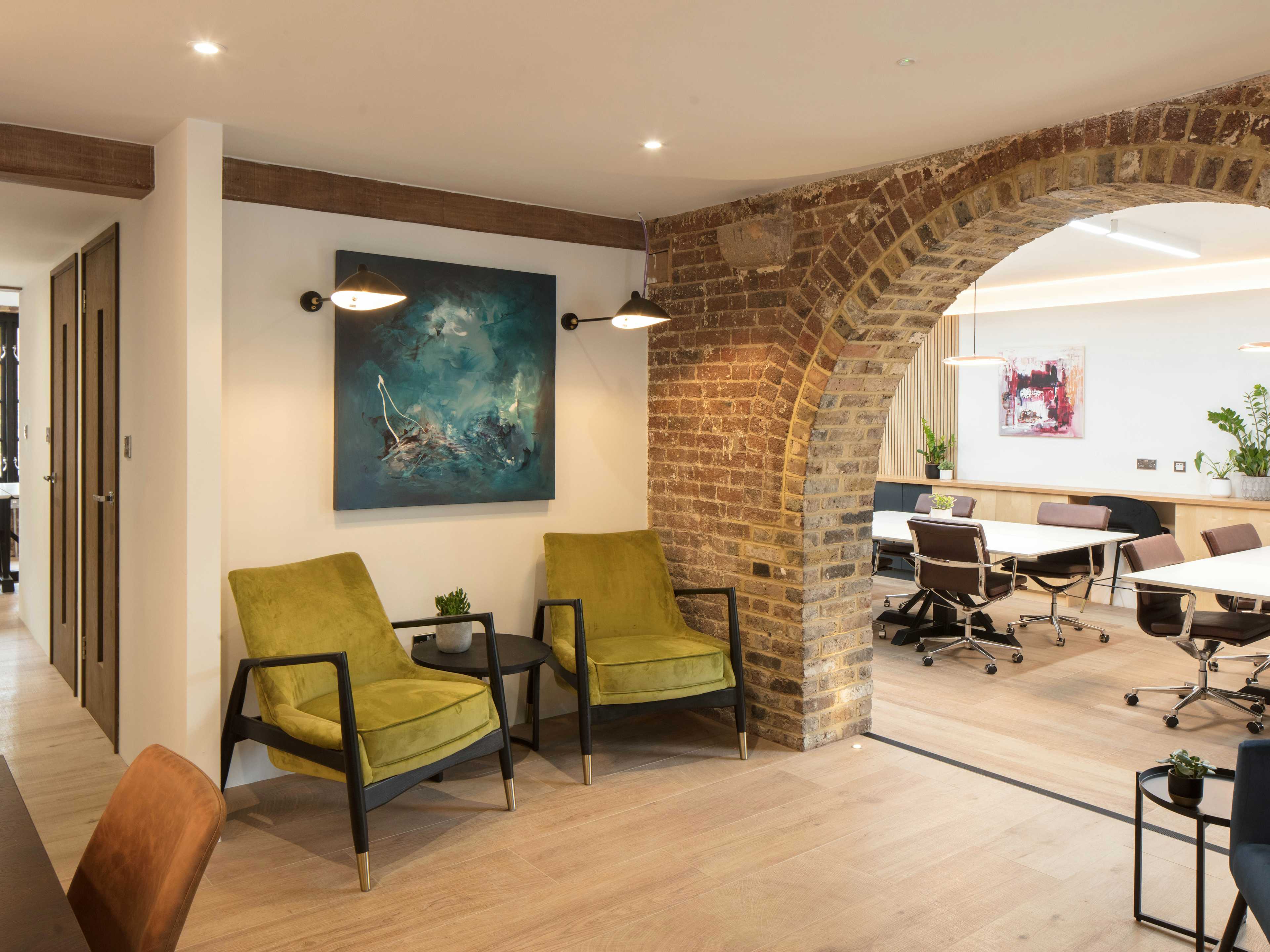 Modern private office meeting space with vibrant seating for networking and collaboration.