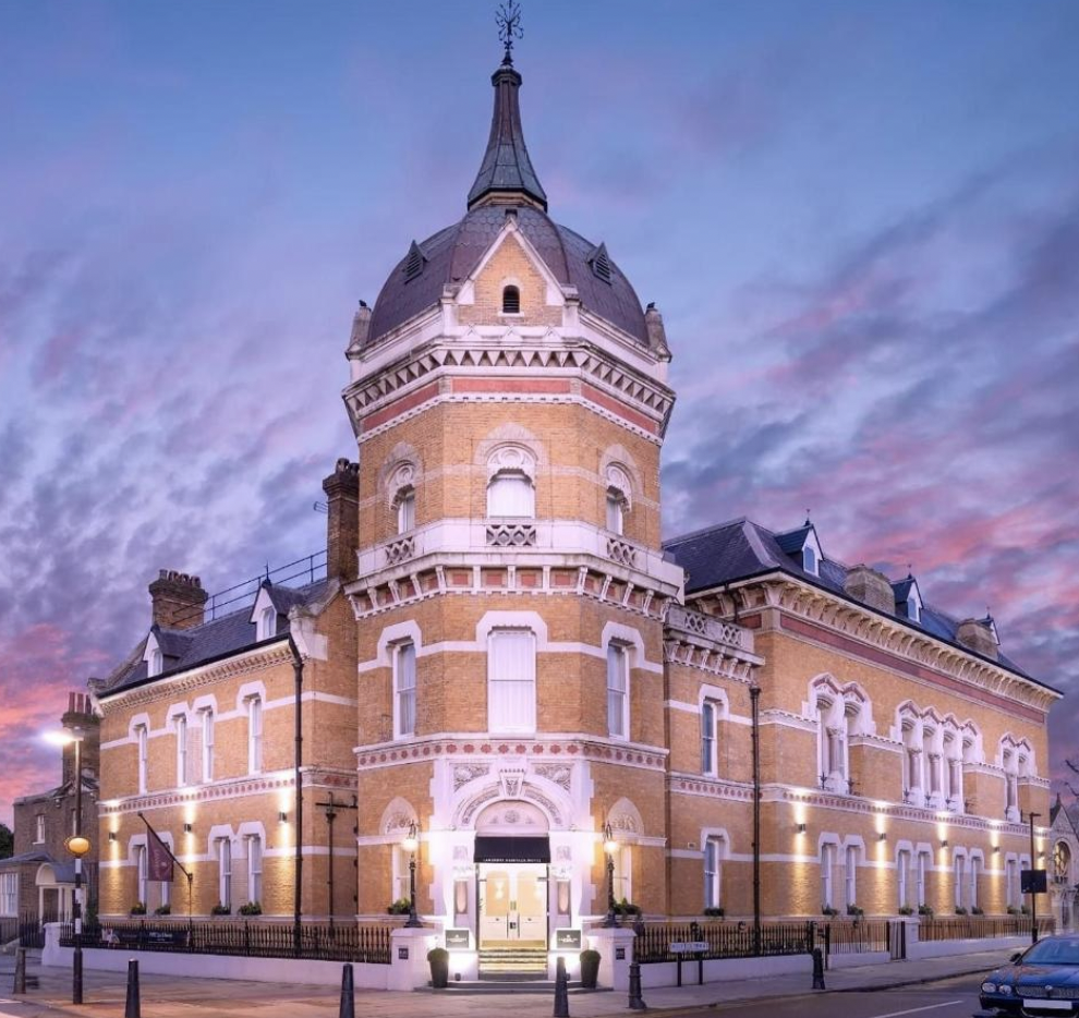 Historic Lansbury Heritage Hotel terrace with unique tower, ideal for elegant events.