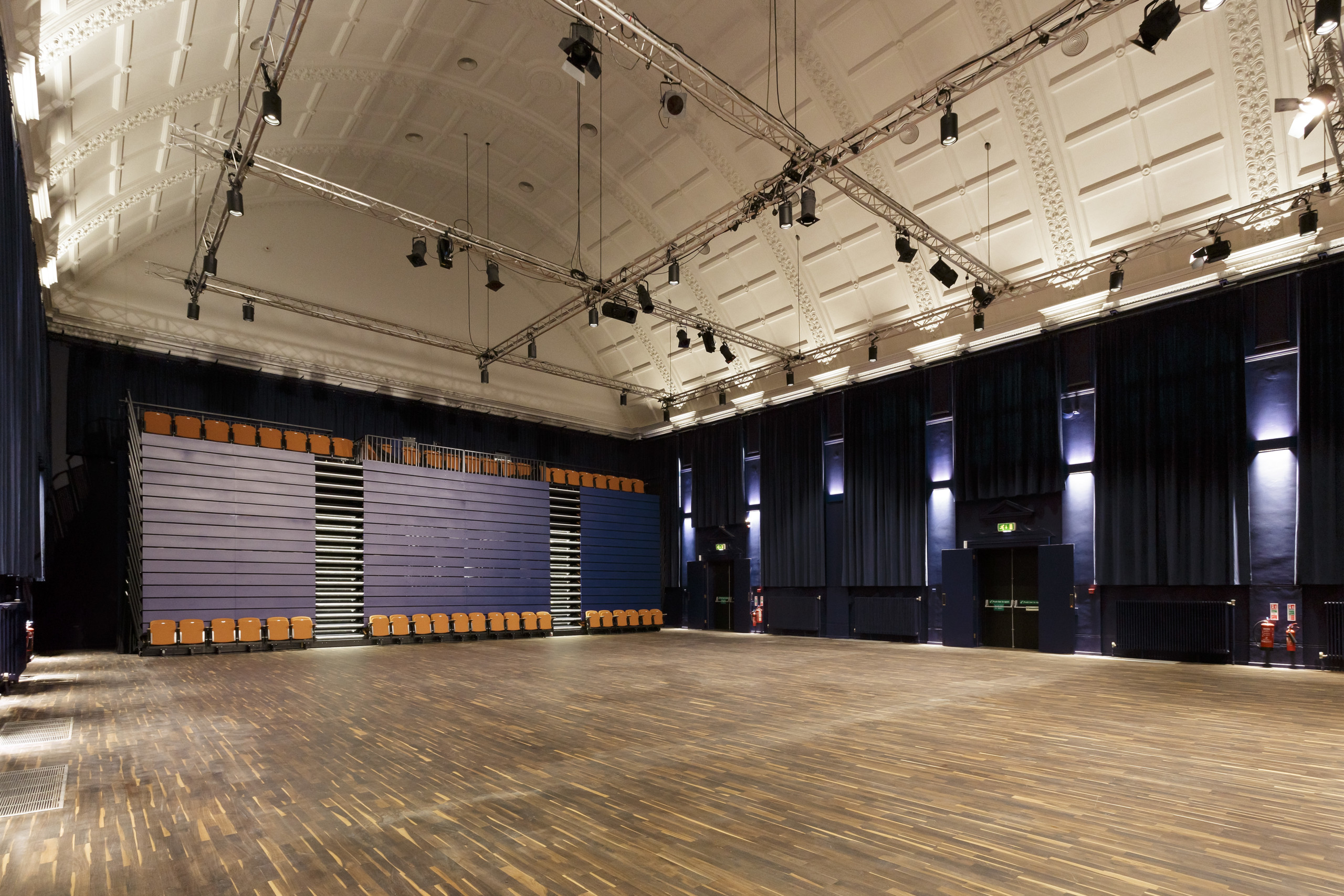 Rehearsal at Blackheath Halls, spacious venue with polished wooden floor for events.