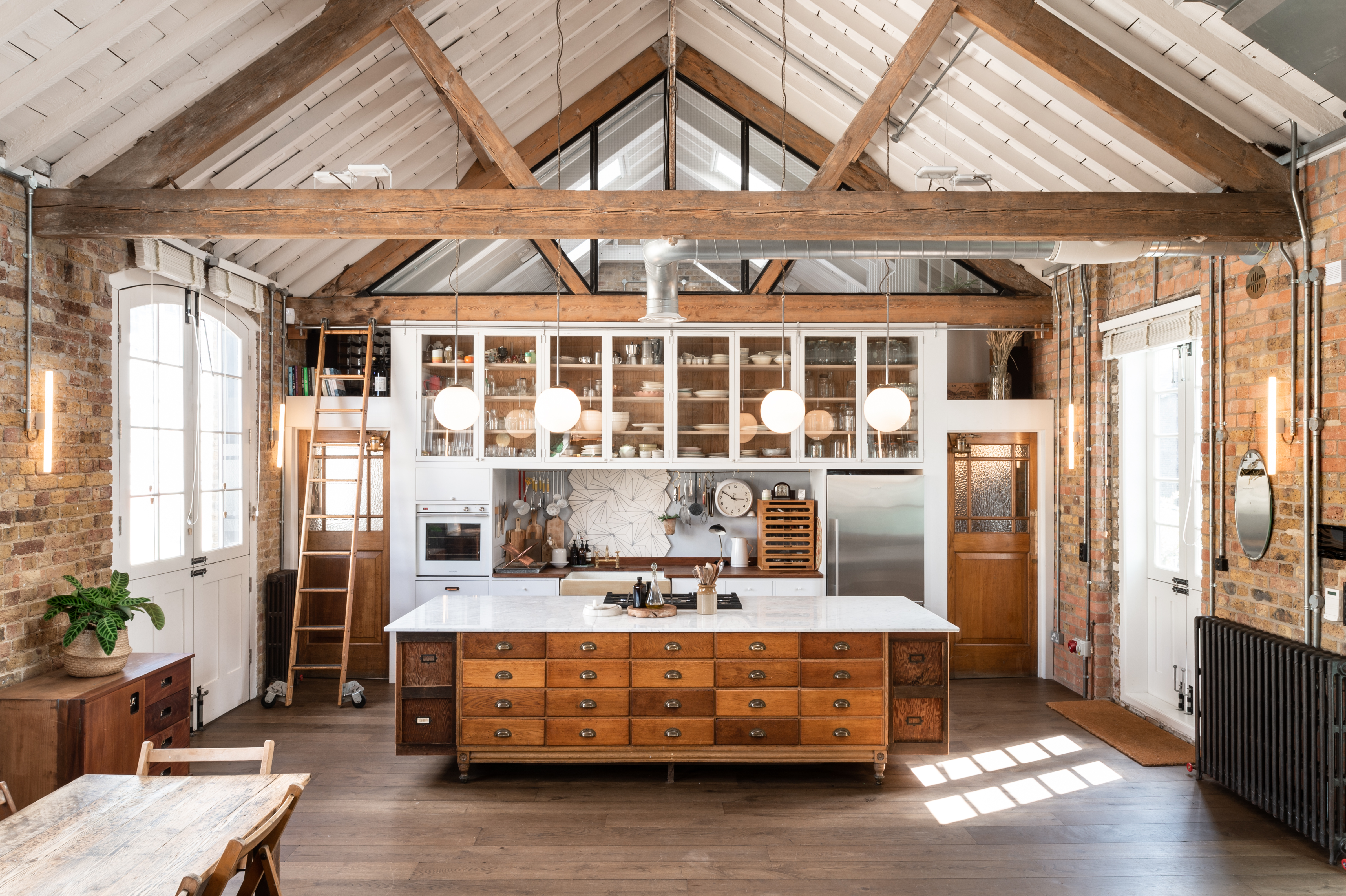 Spacious Loft Studio kitchen with rustic beams, ideal for cooking demos and private events.