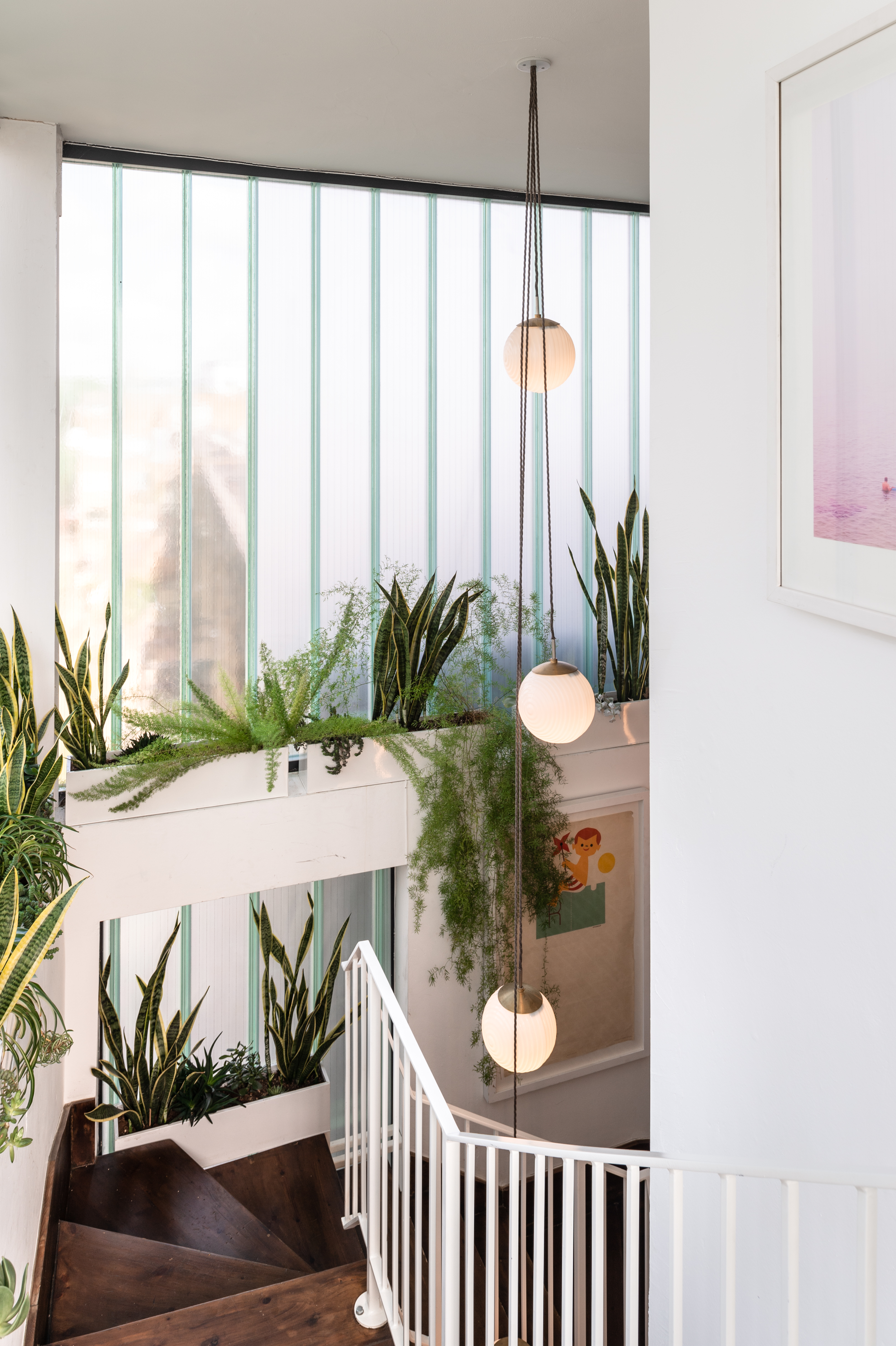 Bright Loft Studio with greenery, ideal for workshops and networking events.