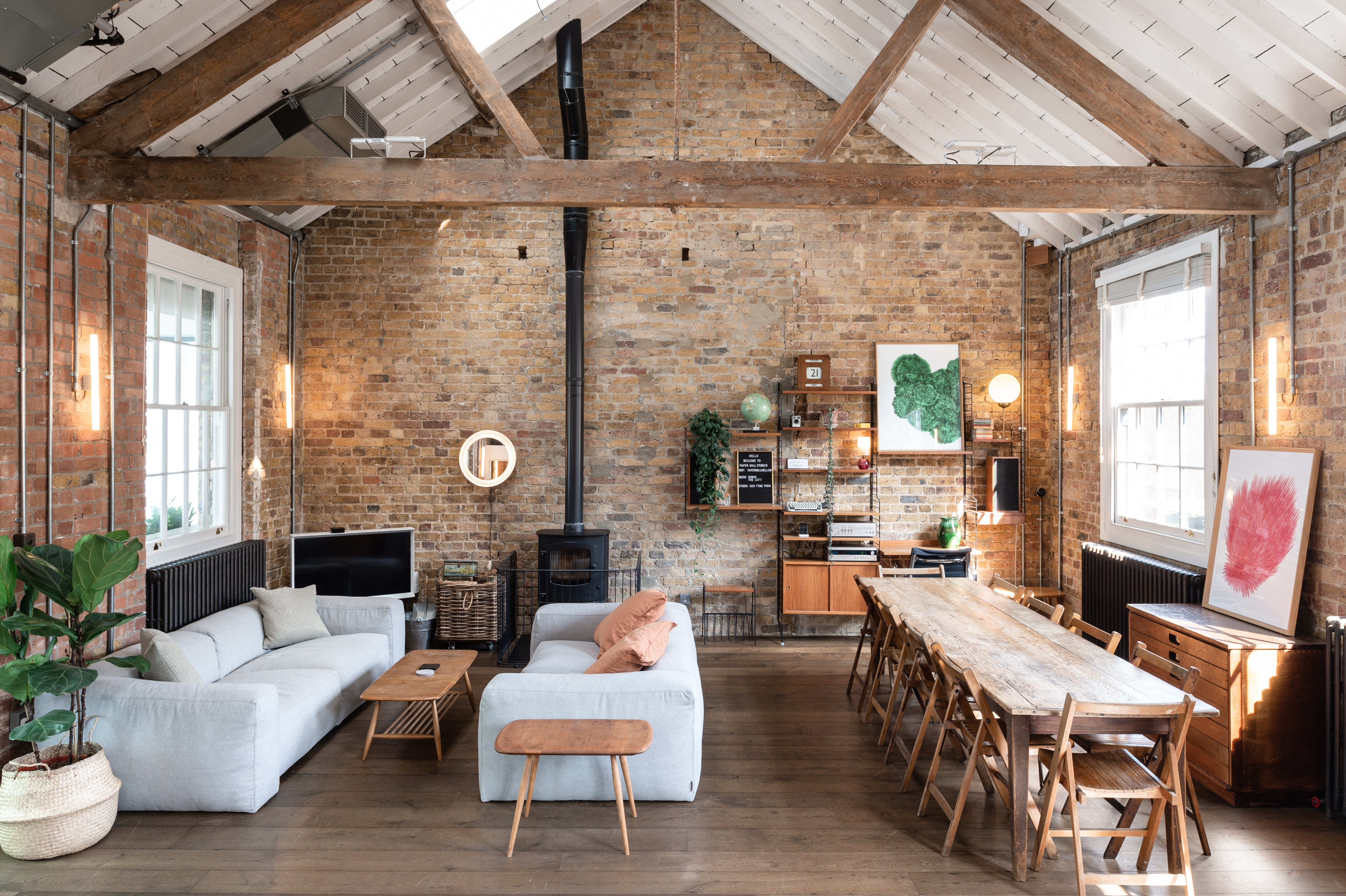 Spacious Loft Studio with exposed brick for intimate meetings and small events.