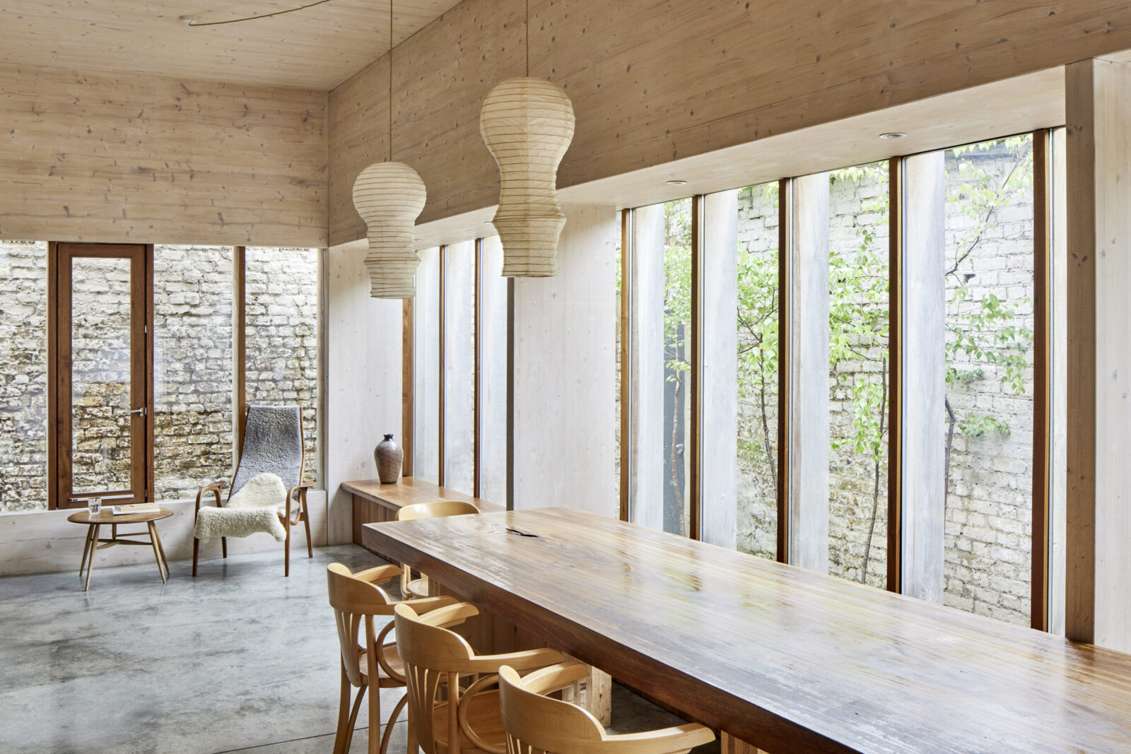 Modern meeting space with wooden table and natural light at Evelyn Community Centre.