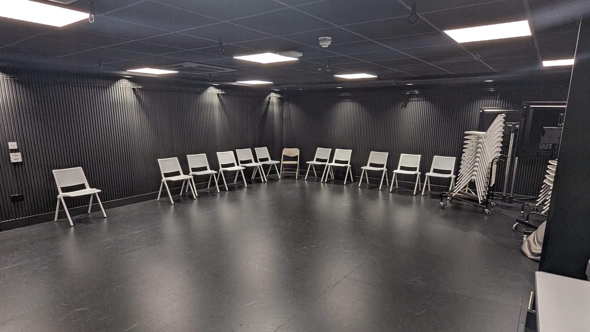 Recording booth in BLOC with circular chairs for workshops and discussions.