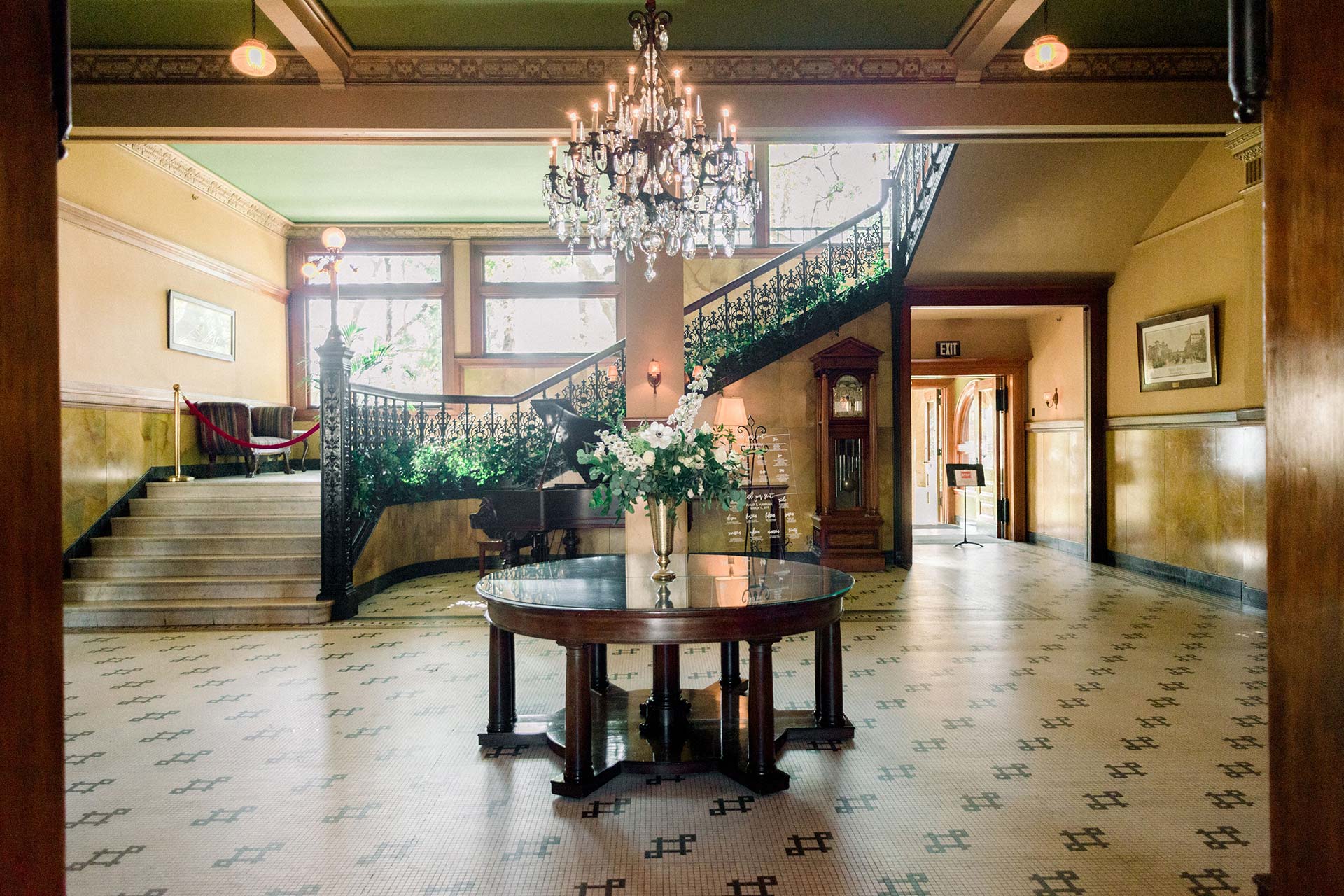 Elegant Castle Green lobby with grand staircase, ideal for upscale receptions and networking.