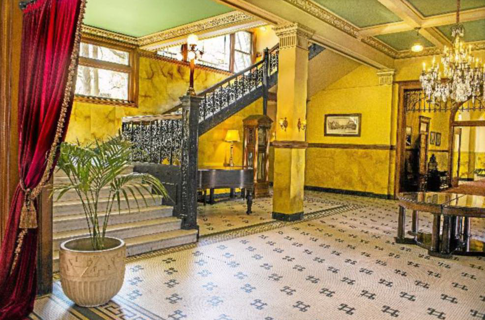 Elegant Castle Green lobby with grand staircase, perfect for sophisticated events.