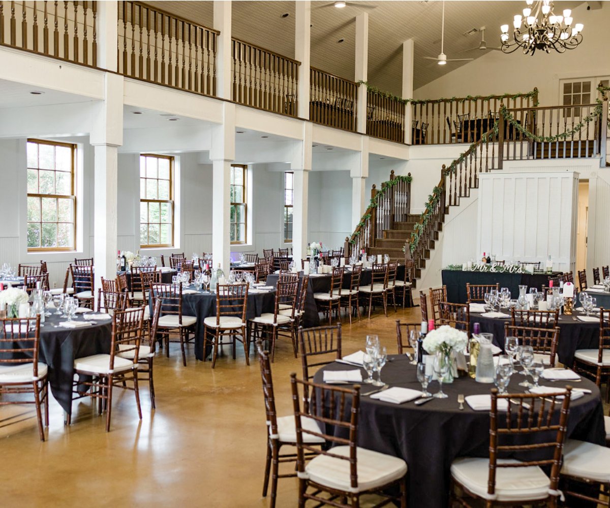 Hofmann Ranch event space with elegant black tables, perfect for weddings and celebrations.
