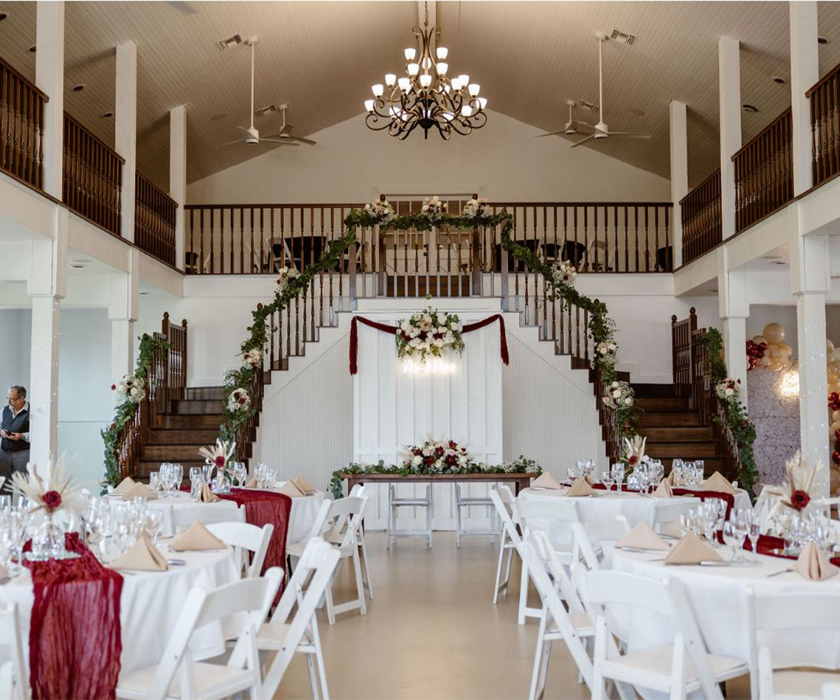 Elegant Hofmann Ranch event space with floral staircase, ideal for weddings and gatherings.
