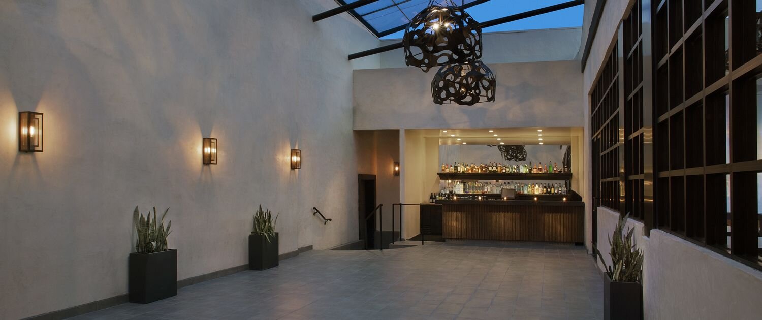 Stylish event space in Sunset Room Hollywood with modern bar, ideal for networking and receptions.