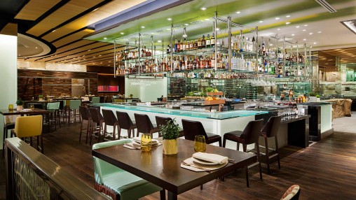 Modern upscale restaurant lounge with sleek bar, perfect for networking events.