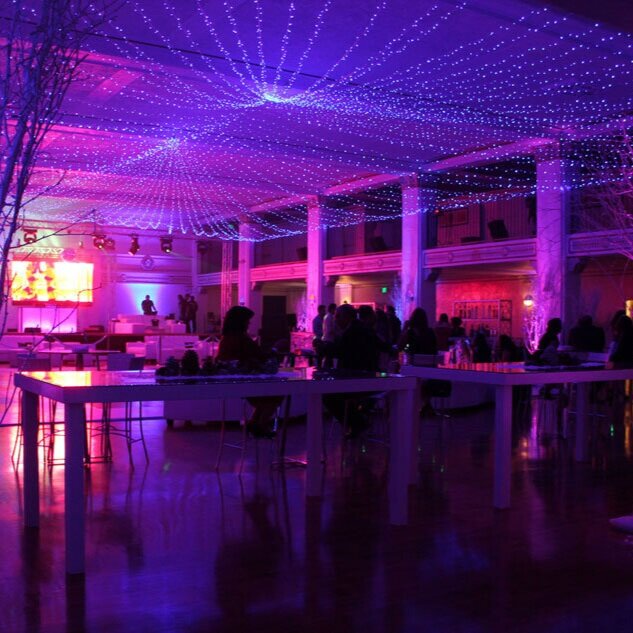 Penthouse event space in Casa Vertigo with colorful lighting for networking and celebrations.