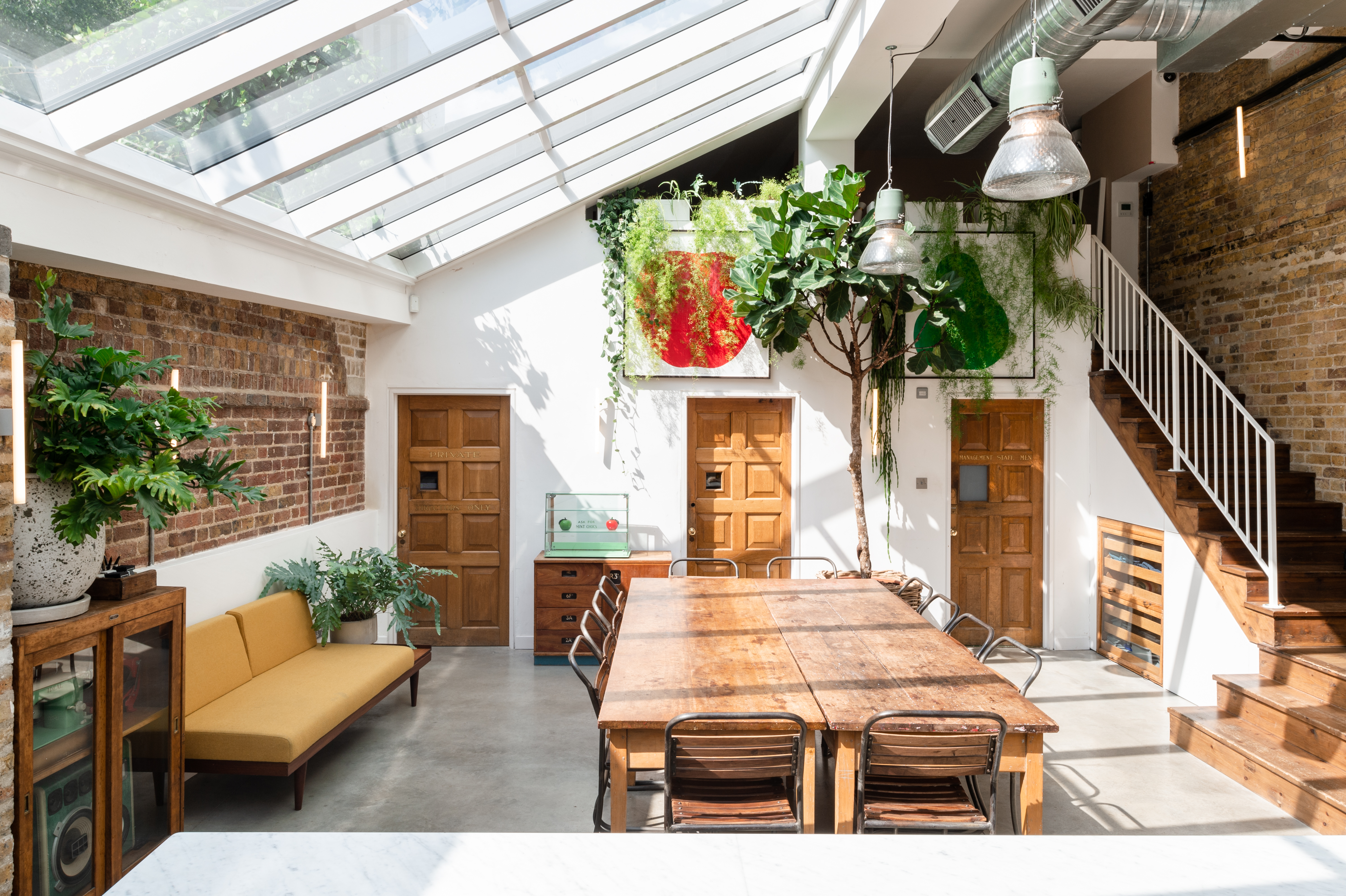Inviting meeting room with wooden table for workshops at Paper Mill Studio, Tastemade.