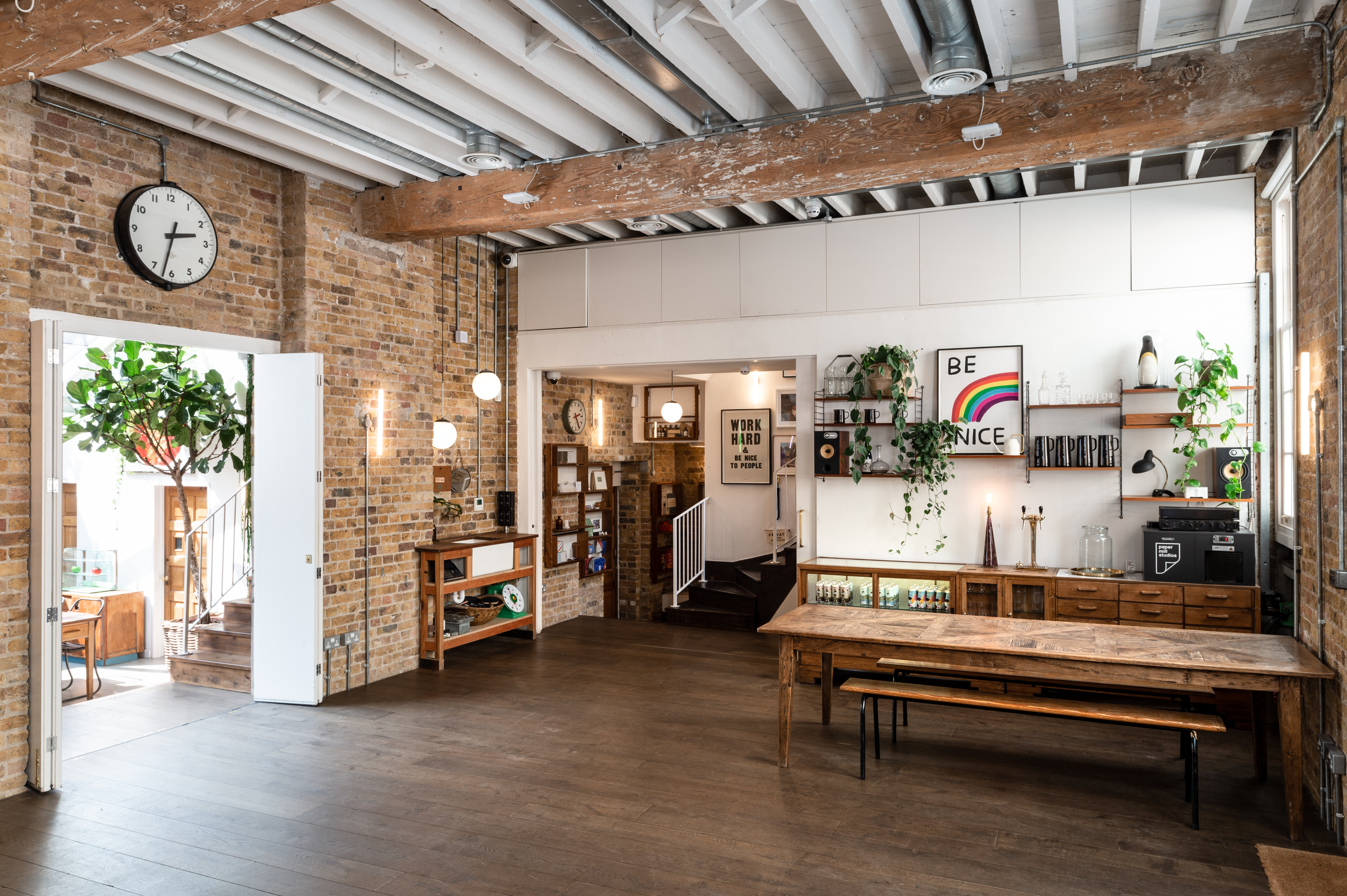 "Paper Mill Studio event space with rustic brick, ideal for workshops and networking."