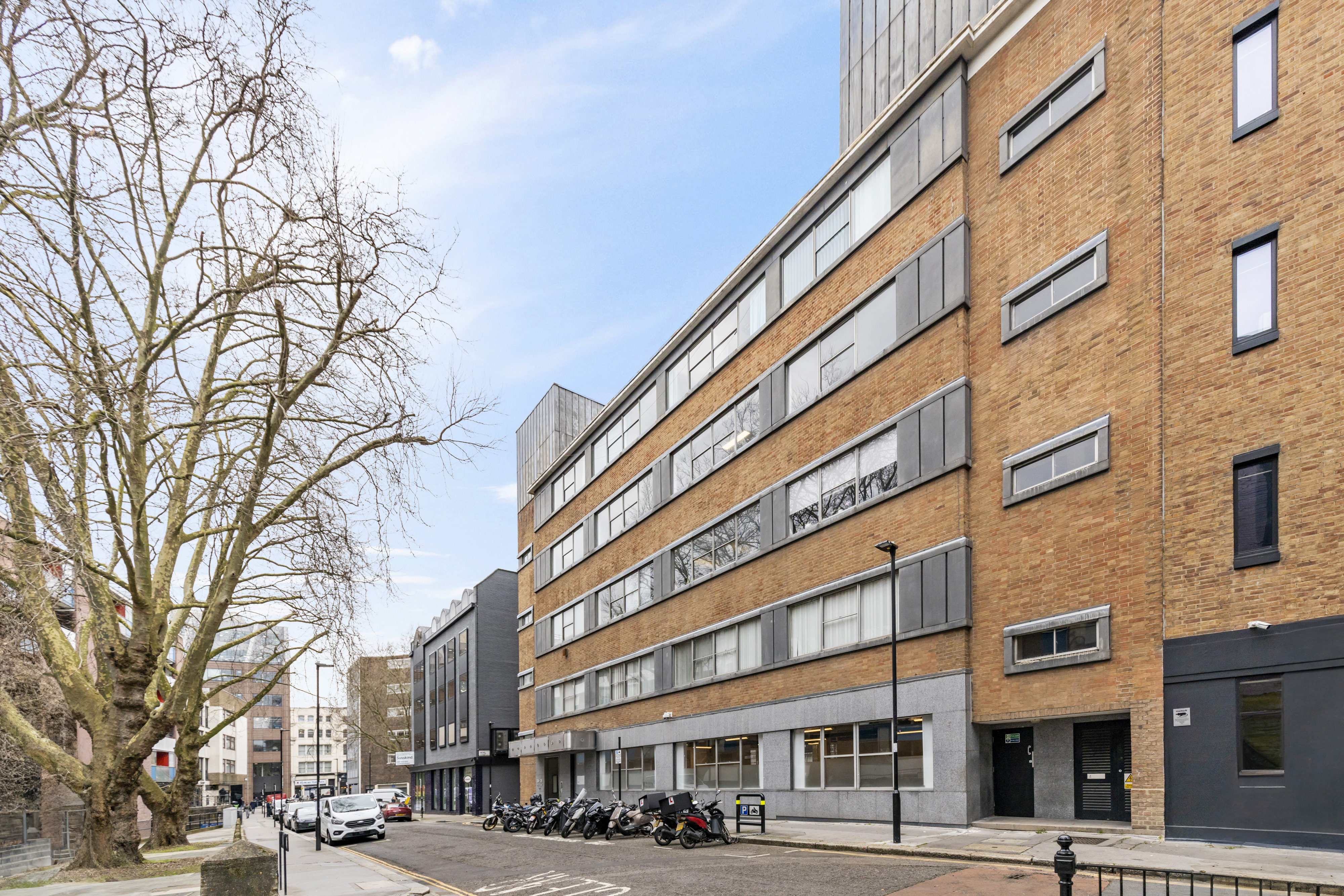 Modern meeting room with large windows, perfect for events in urban venue Baltic St W.