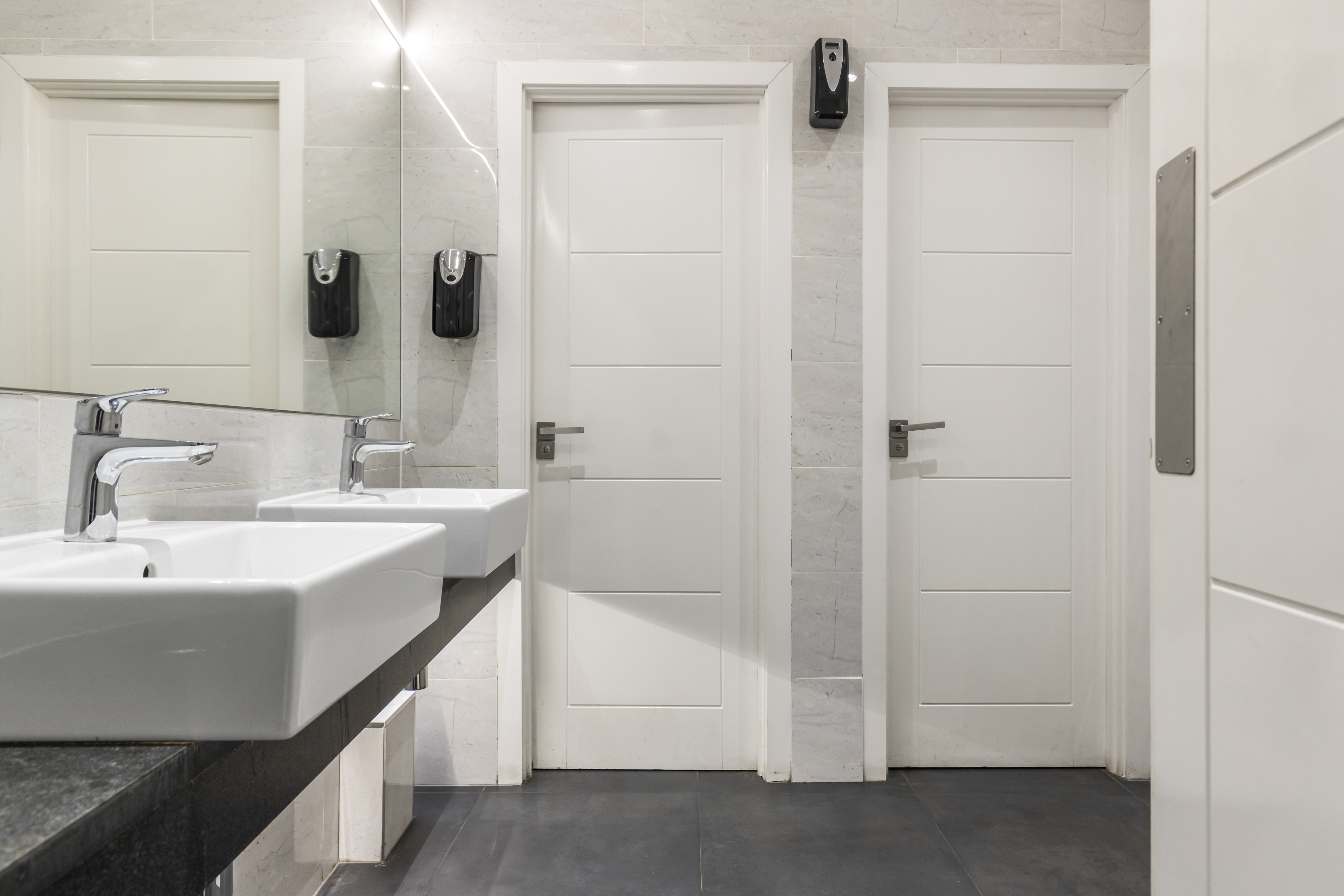 Modern restroom with dual sinks in Meeting Room 3, ideal for events and guest comfort.