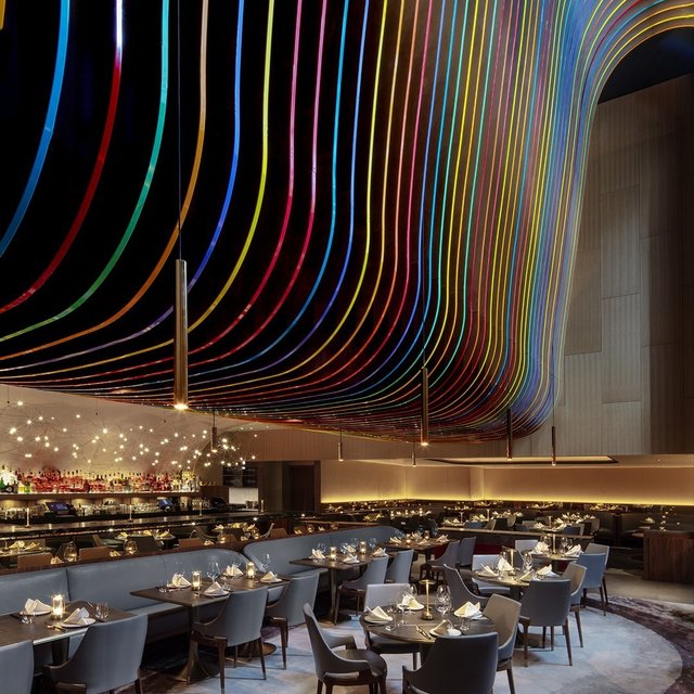 Vibrant Main Dining Room with colorful ceiling, ideal for events and gatherings.