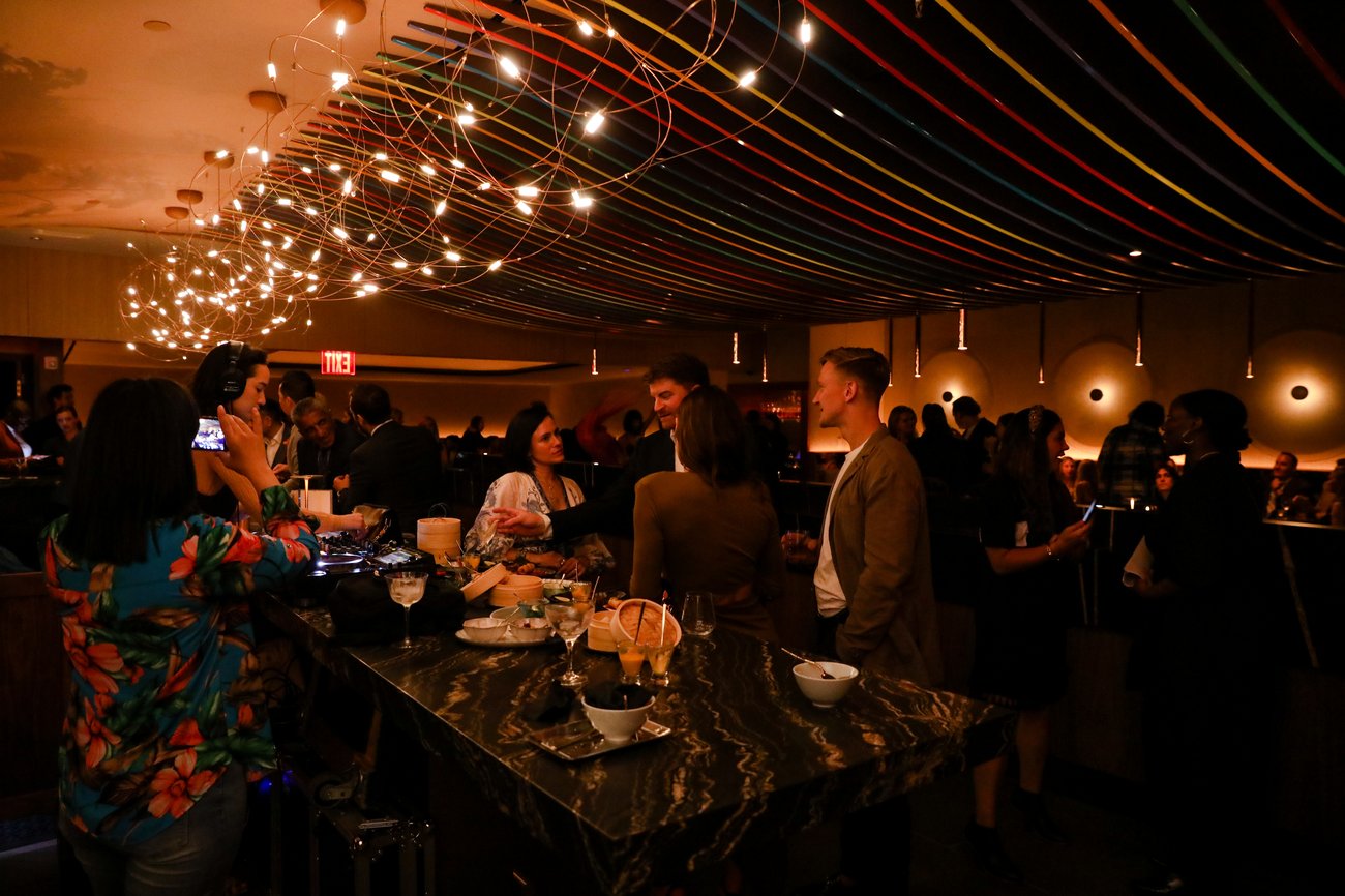 Vibrant networking event at 53 Restaurant with colorful decor and social atmosphere.