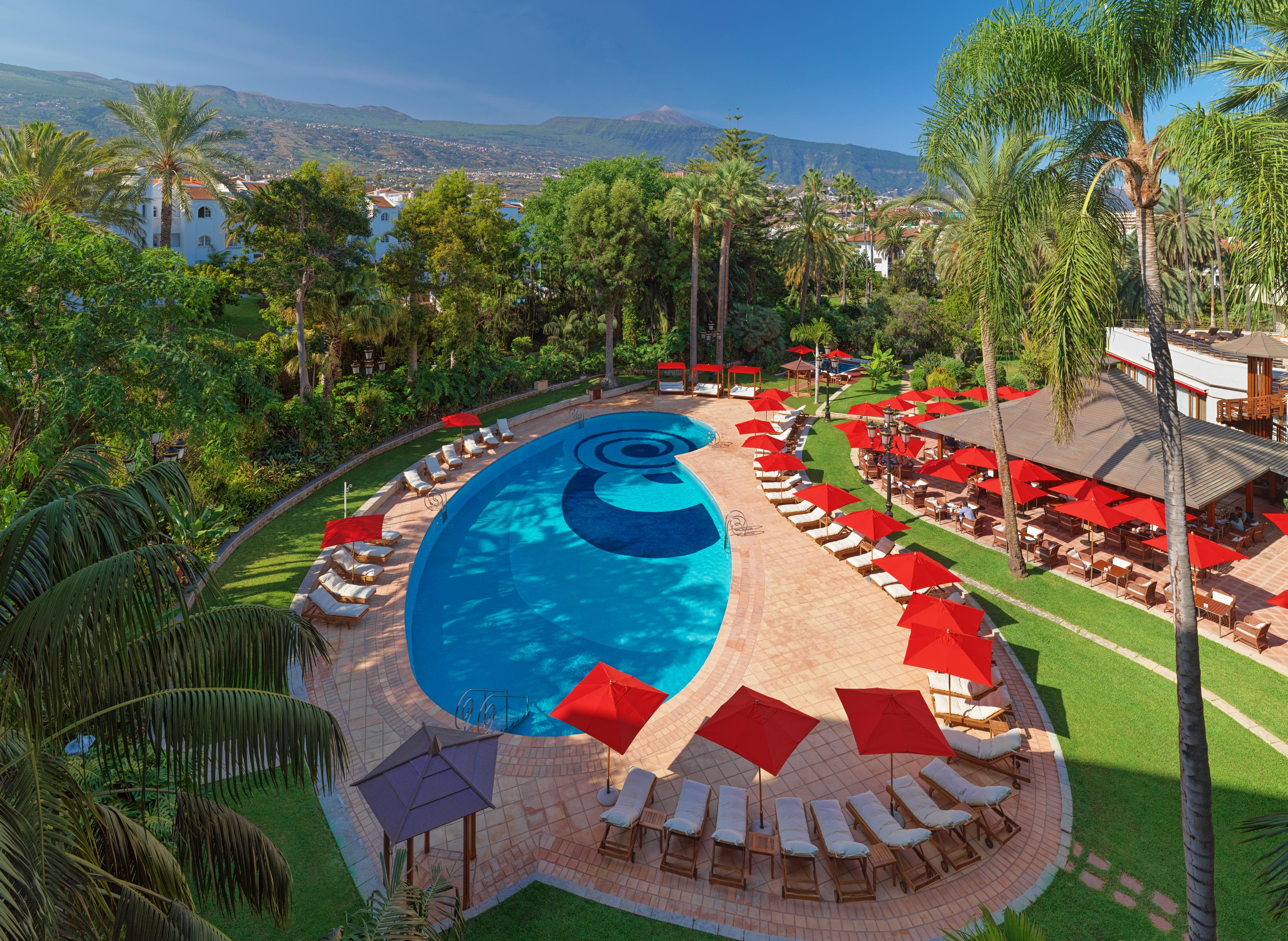 Oriental Restaurant pool area with red umbrellas, ideal for outdoor events and gatherings.