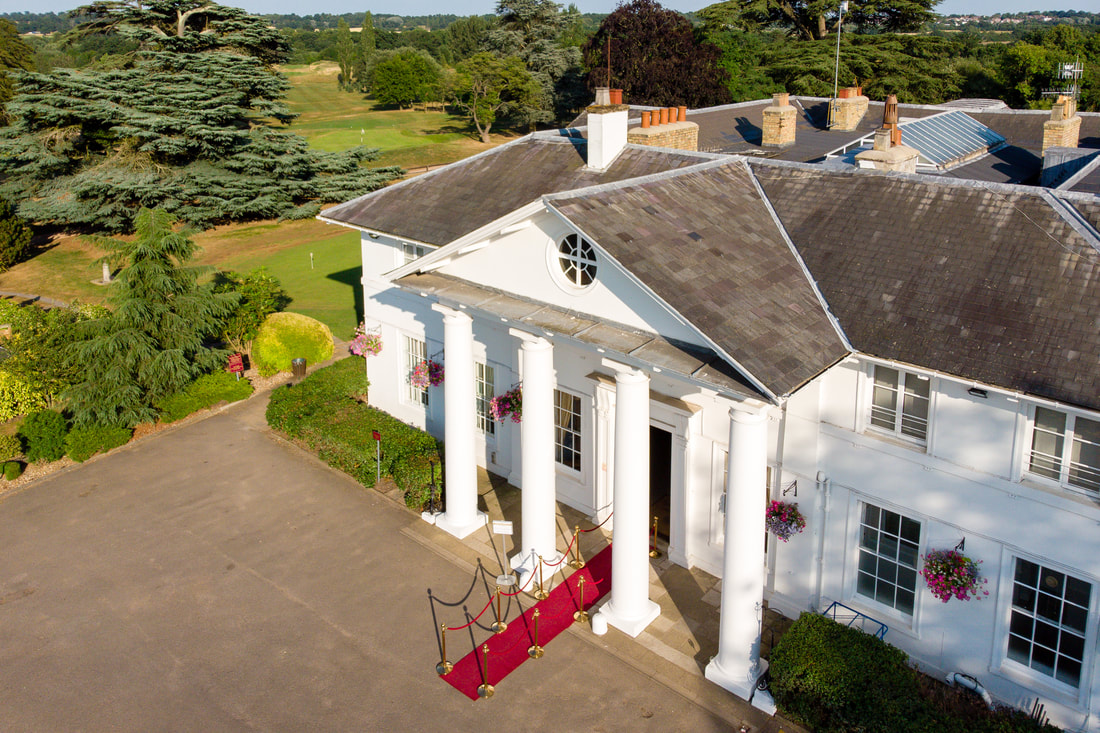 Elegant Dyrham Park Country Club bridge with classic columns, perfect for upscale events.