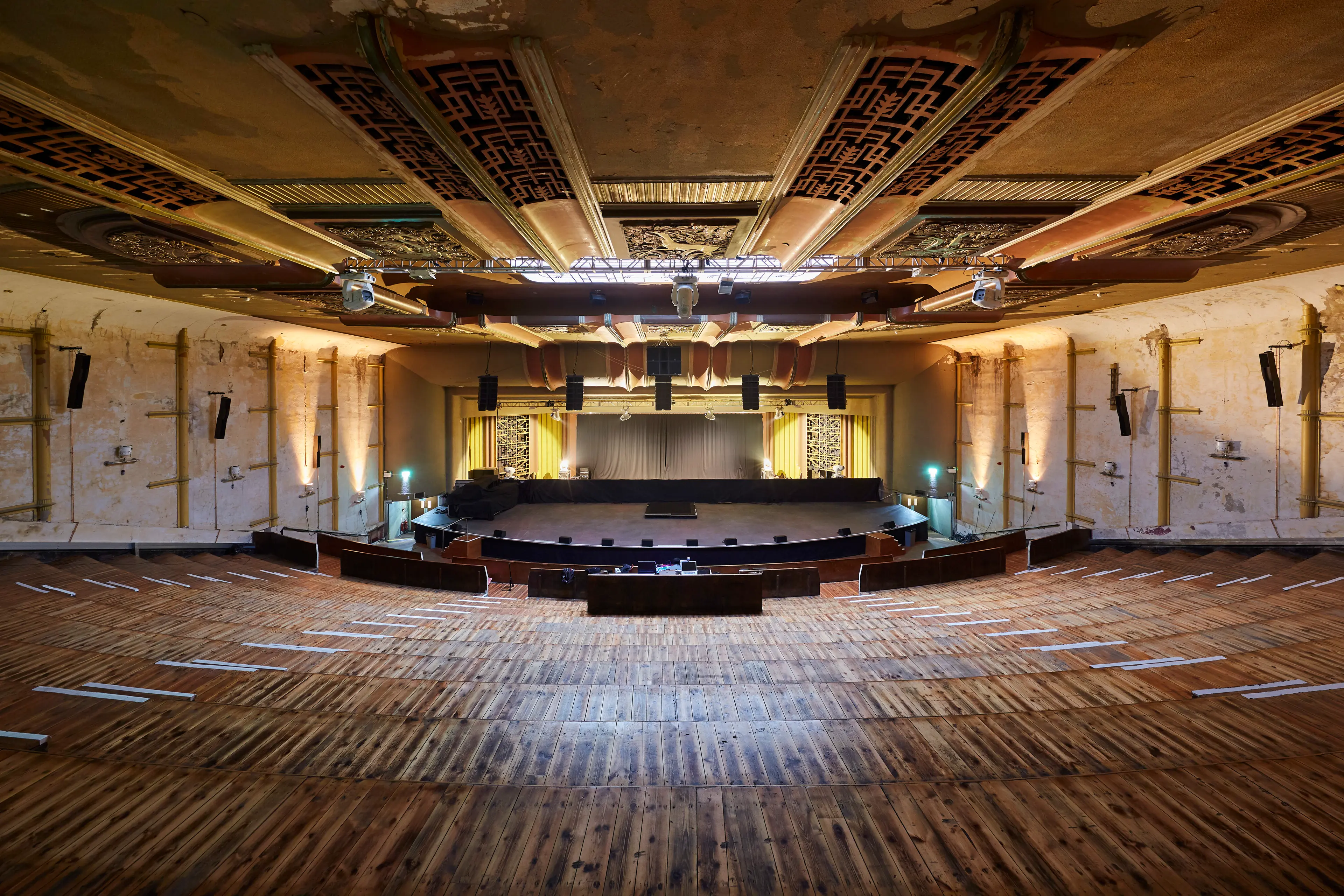 Mezzanine Level auditorium in Hackney Venues with tiered seating for conferences and performances.