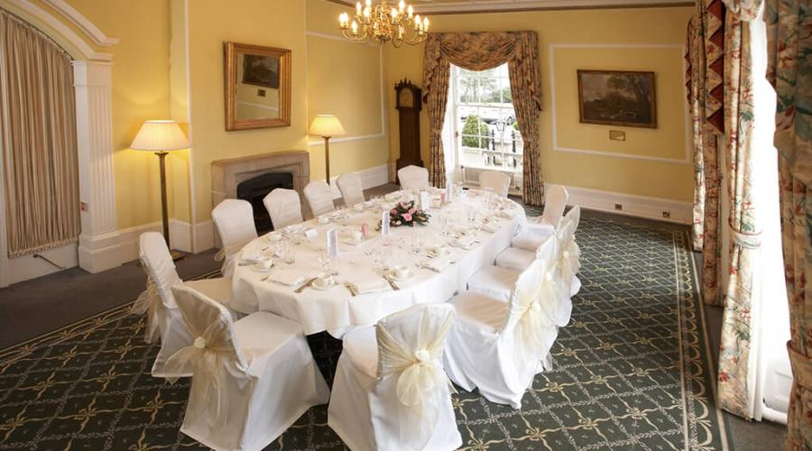 West Lodge Park Suite meeting room with elegant round table, ideal for corporate events.