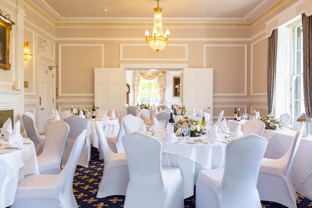 Elegant banquet room with round tables for weddings and corporate events at West Lodge Park.