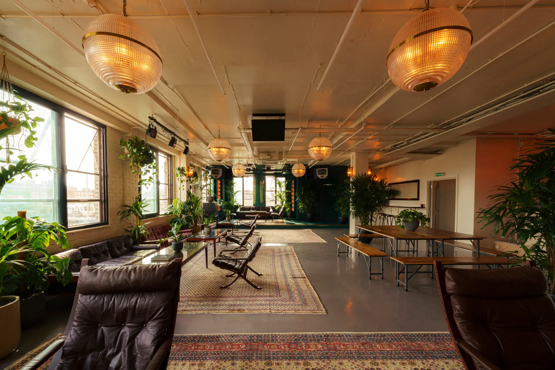 Modern event space with natural light, ideal for workshops and networking.