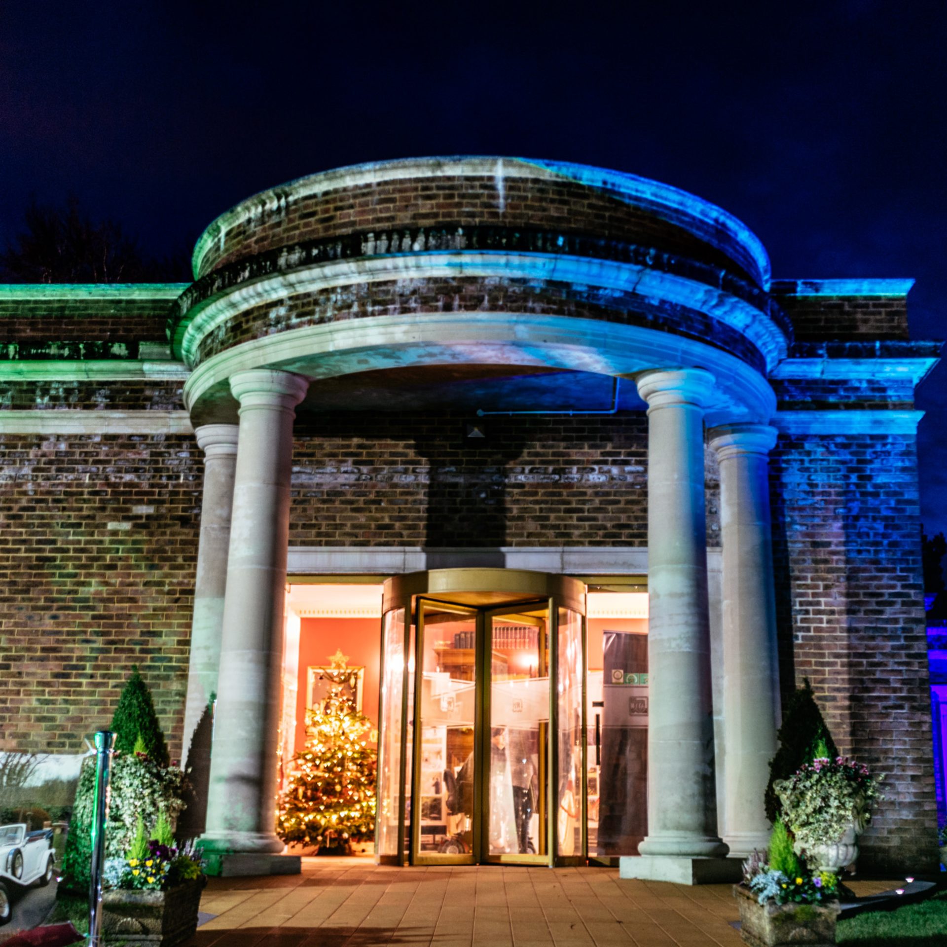 Elegant Floral Suite entrance with revolving door, perfect for upscale events and celebrations.