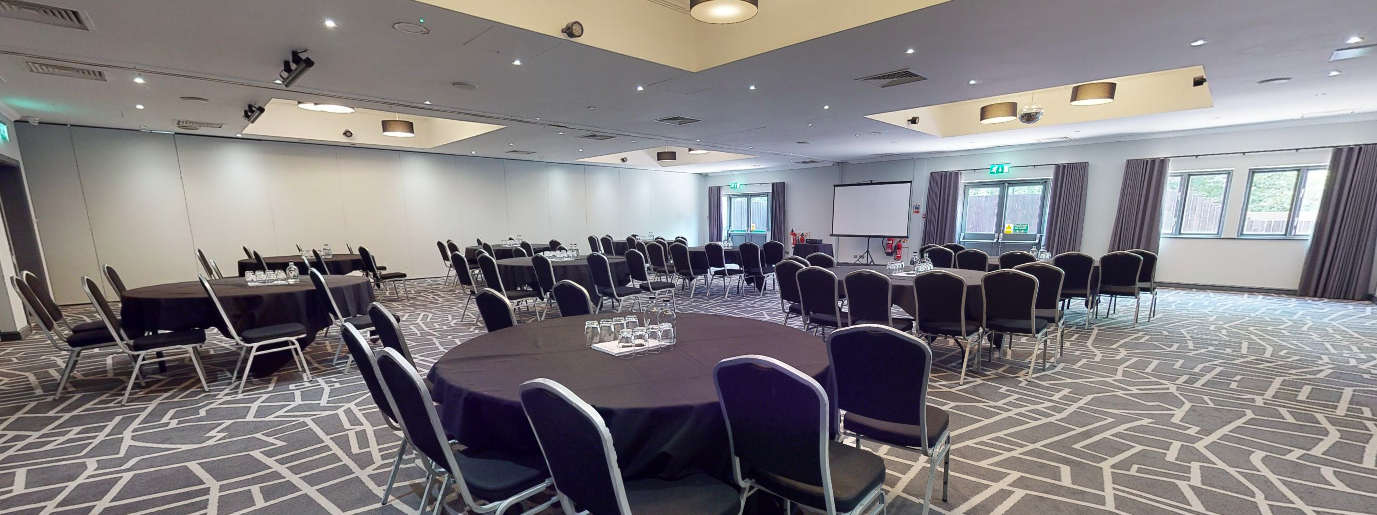 Inspiration 2 meeting space in Cardiff, featuring round tables for networking events.