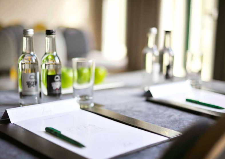 Morgannwg Suite meeting setup with fresh apples, ideal for corporate events and brainstorming.