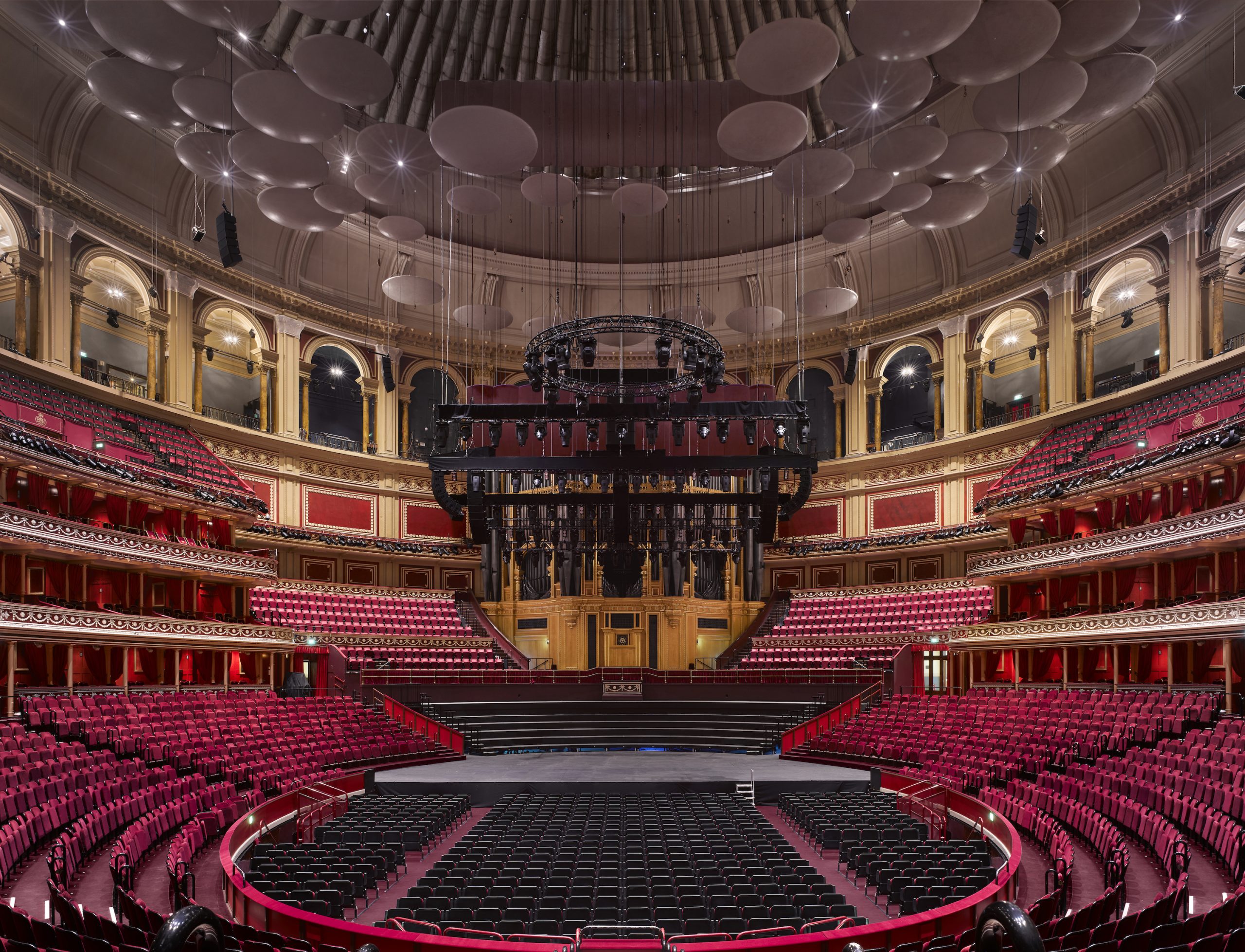 Royal Albert Hall concert venue with tiered seating and grand stage for events.