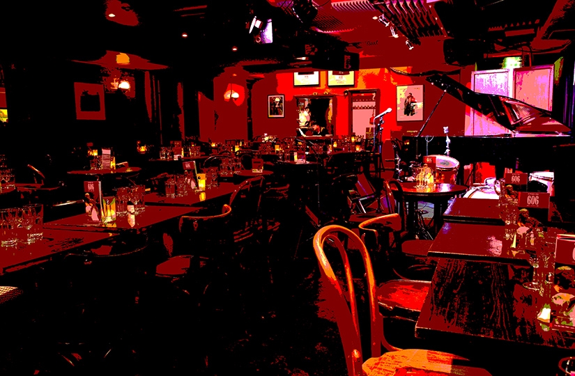 Intimate 606 Club venue with warm lighting, perfect for live music events and gatherings.