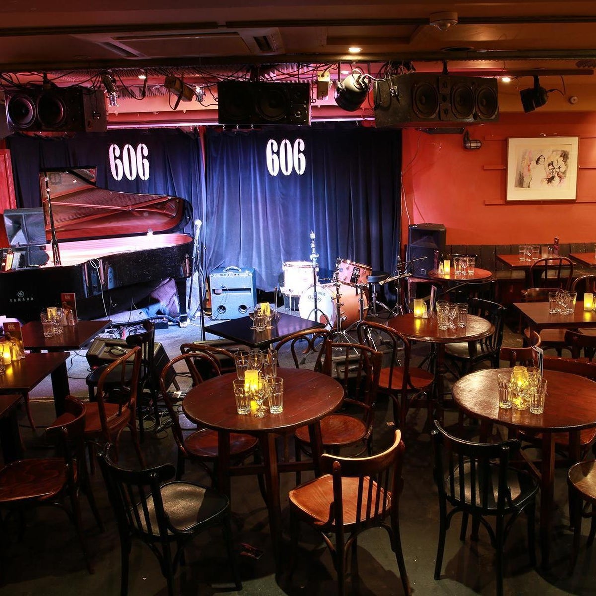 Cozy jazz venue 606 Club with grand piano, ideal for live performances and private events.