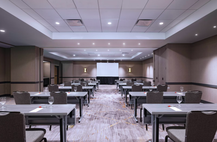 Meeting room at Austin Marriott South with projector screen for corporate events.