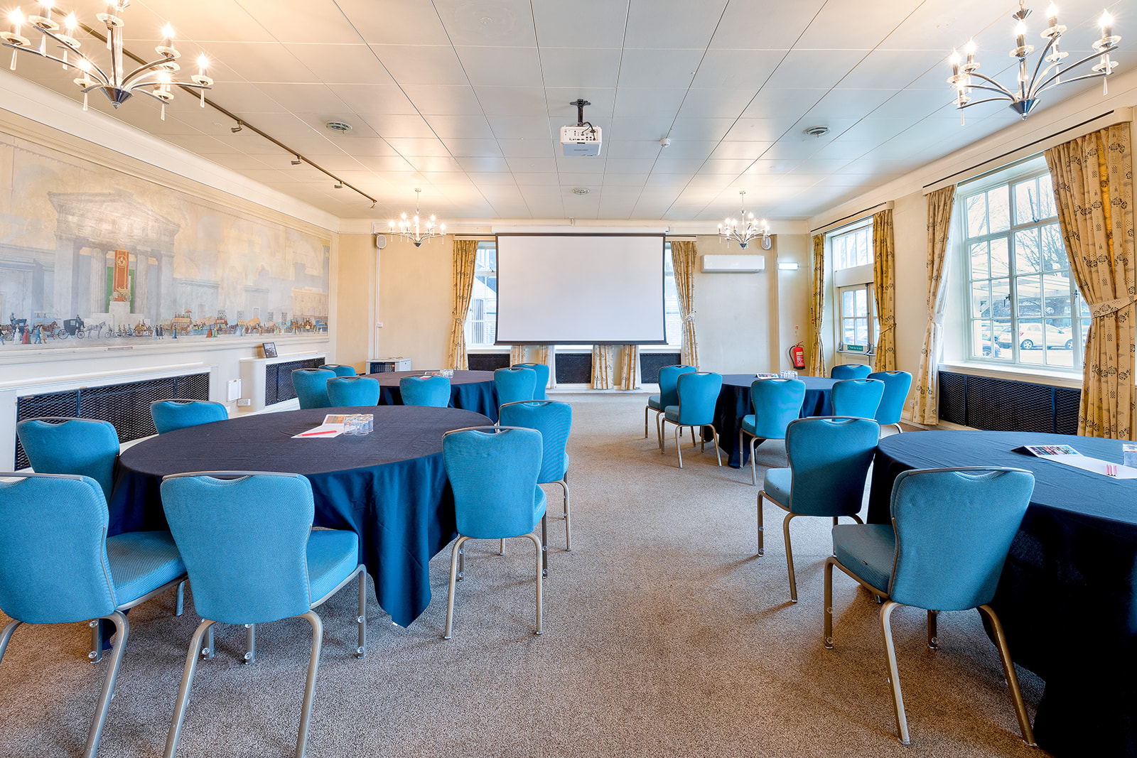 Stephenson and Euston Suite, Derby Conference Centre, elegant meeting room with round tables.