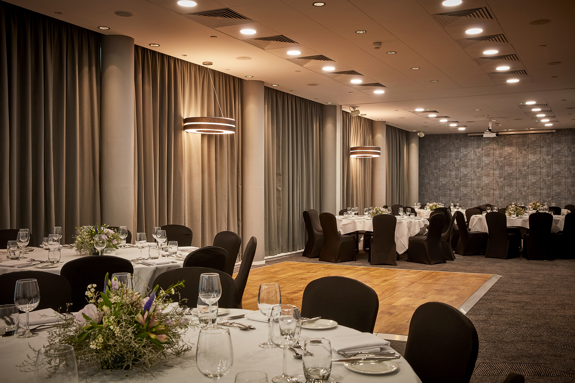 Elegant event space at DoubleTree by Hilton Manchester for corporate gatherings and formal dinners.