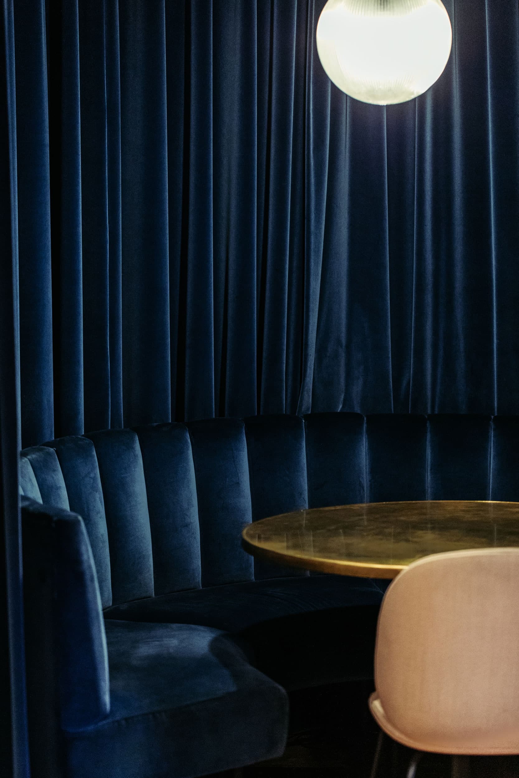 Navy velvet lounge at The Ministry for exclusive VIP meetings and high-touch networking.