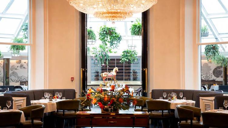 Elegant dining room with chandelier for upscale events and corporate dinners.