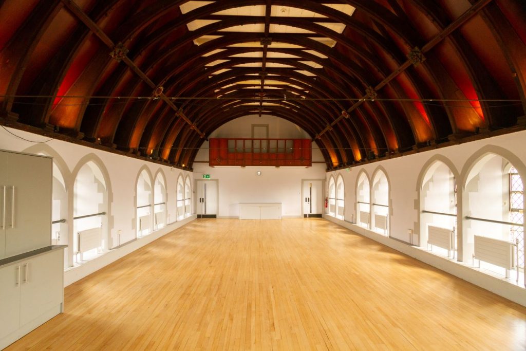 Mortlake Village Hall with arched ceiling, ideal for corporate and social events.