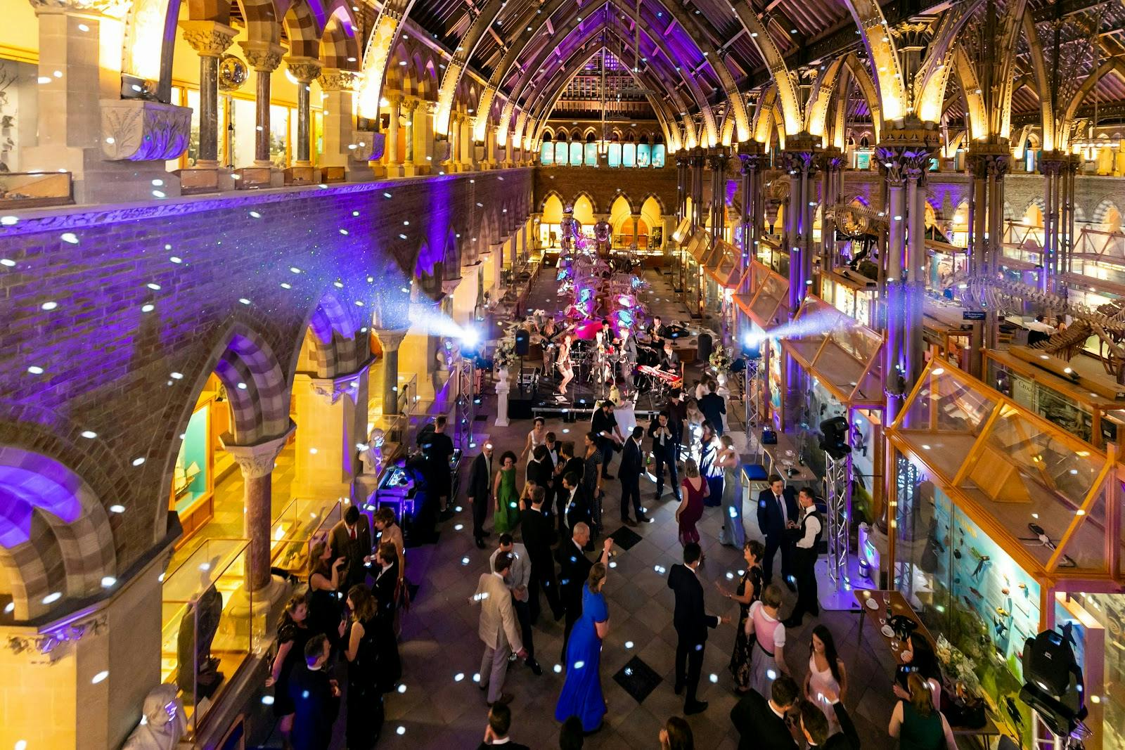 Ballroom event with high ceilings, vibrant atmosphere for networking and engagement.