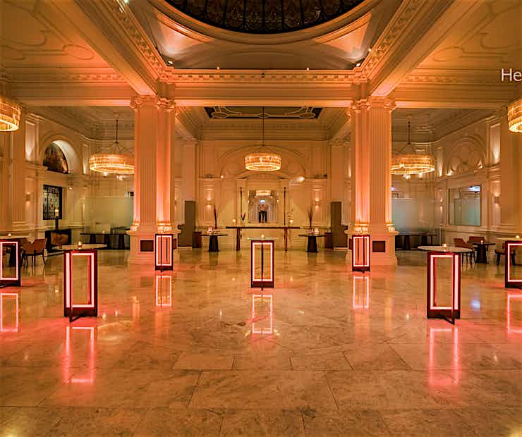 Elegant ballroom with ambient lighting, perfect for networking and cocktail receptions.