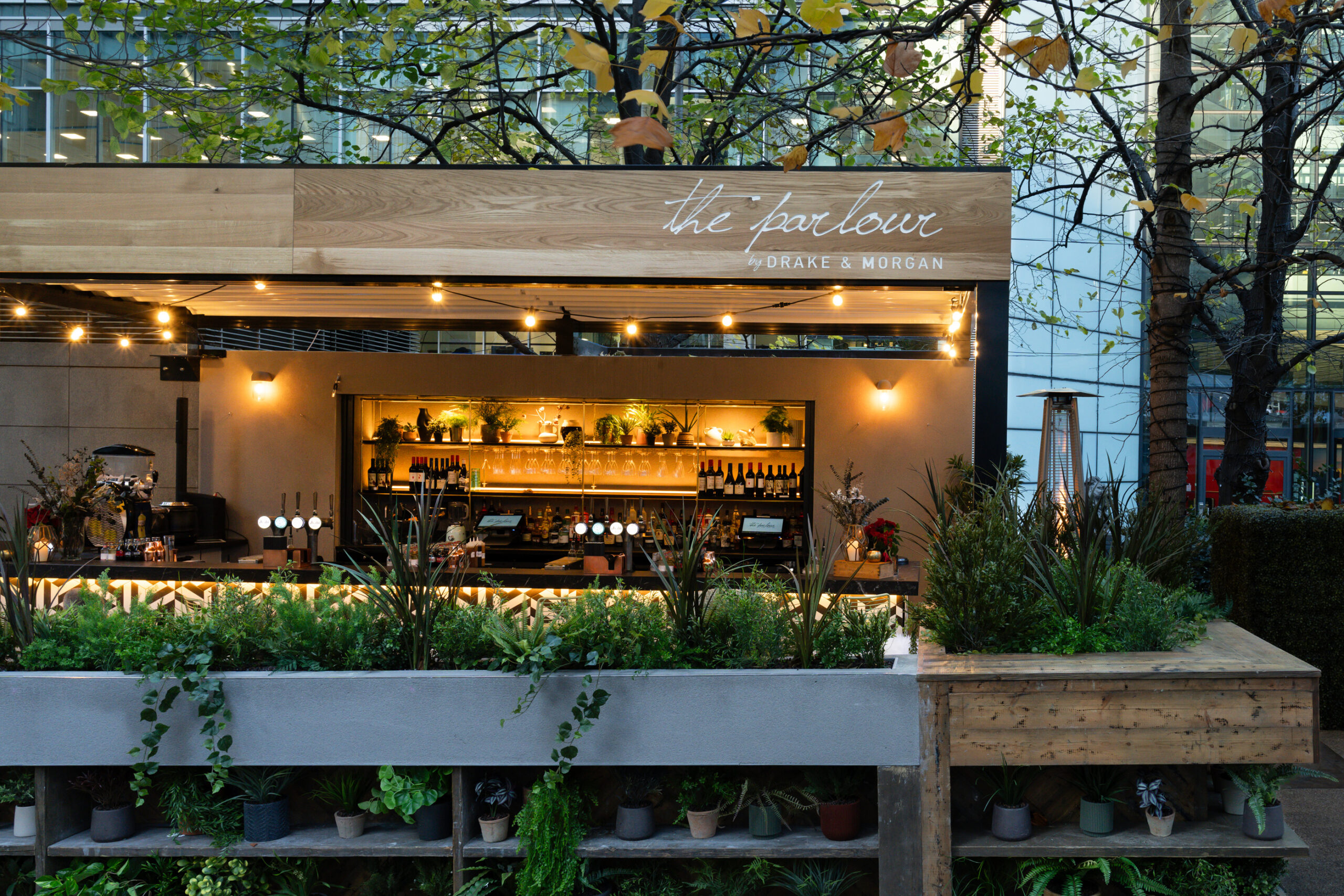 Secret-Garden Inspired Lounge with greenery, ideal for networking events and gatherings.