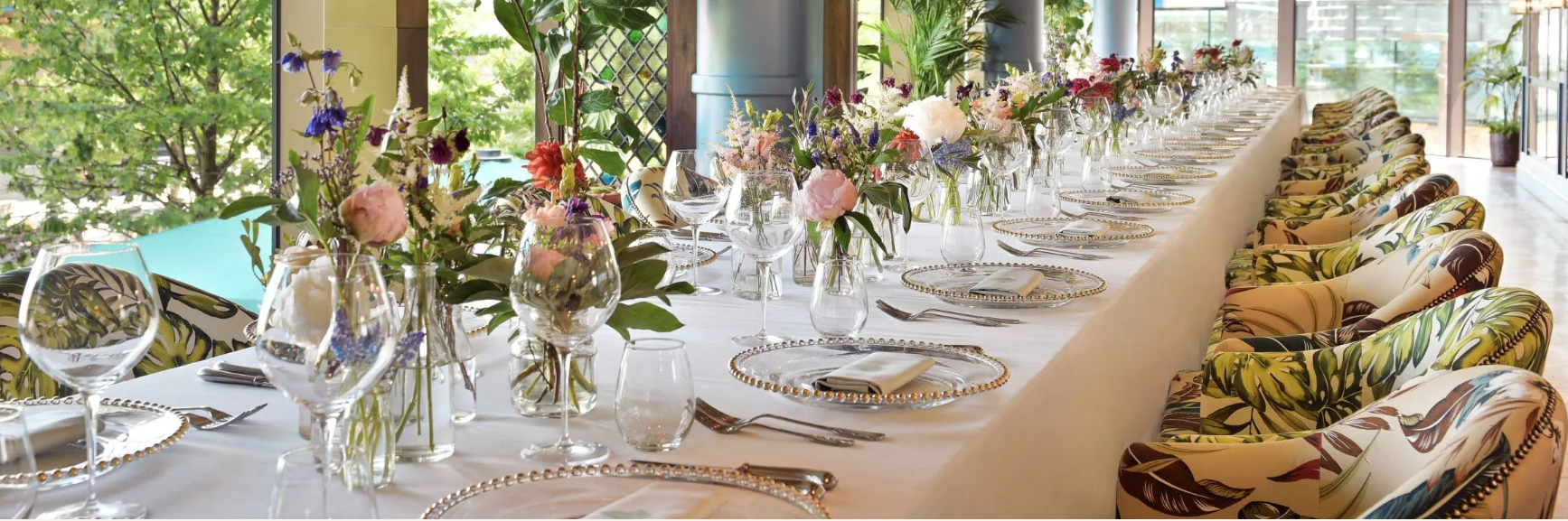Elegant dining table with floral centerpieces at The Ivy Tower Bridge for upscale events.