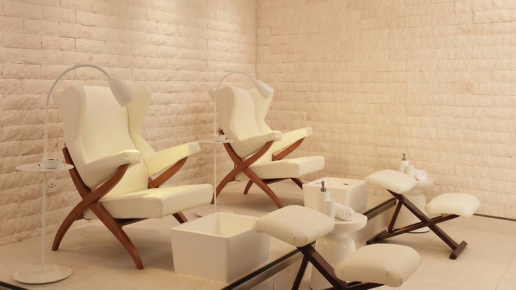 Rooftop lounge at Sea Containers London with luxurious pedicure chairs for corporate retreats.