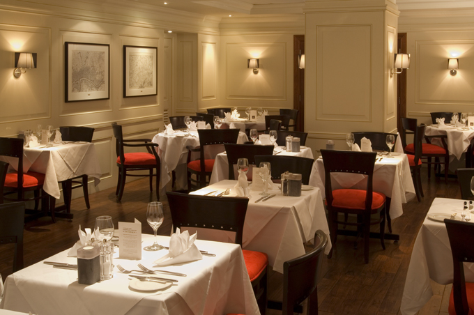 Londinium Restaurant: elegant dining space for corporate events in London Bridge Hotel.