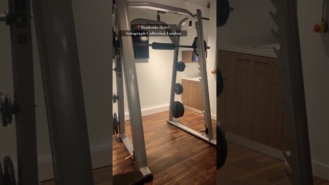 Gym at Bankside Hotel with squat rack, ideal for fitness events and wellness retreats.