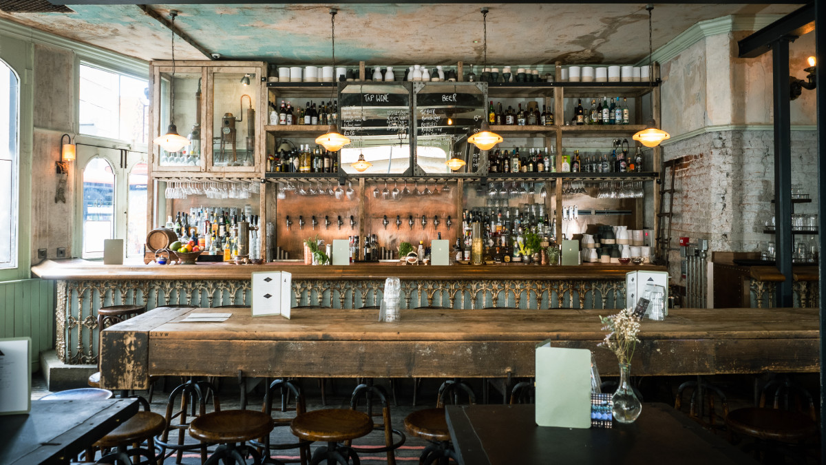 Stylish bar area with rustic counter at Martello Hall, ideal for networking events.