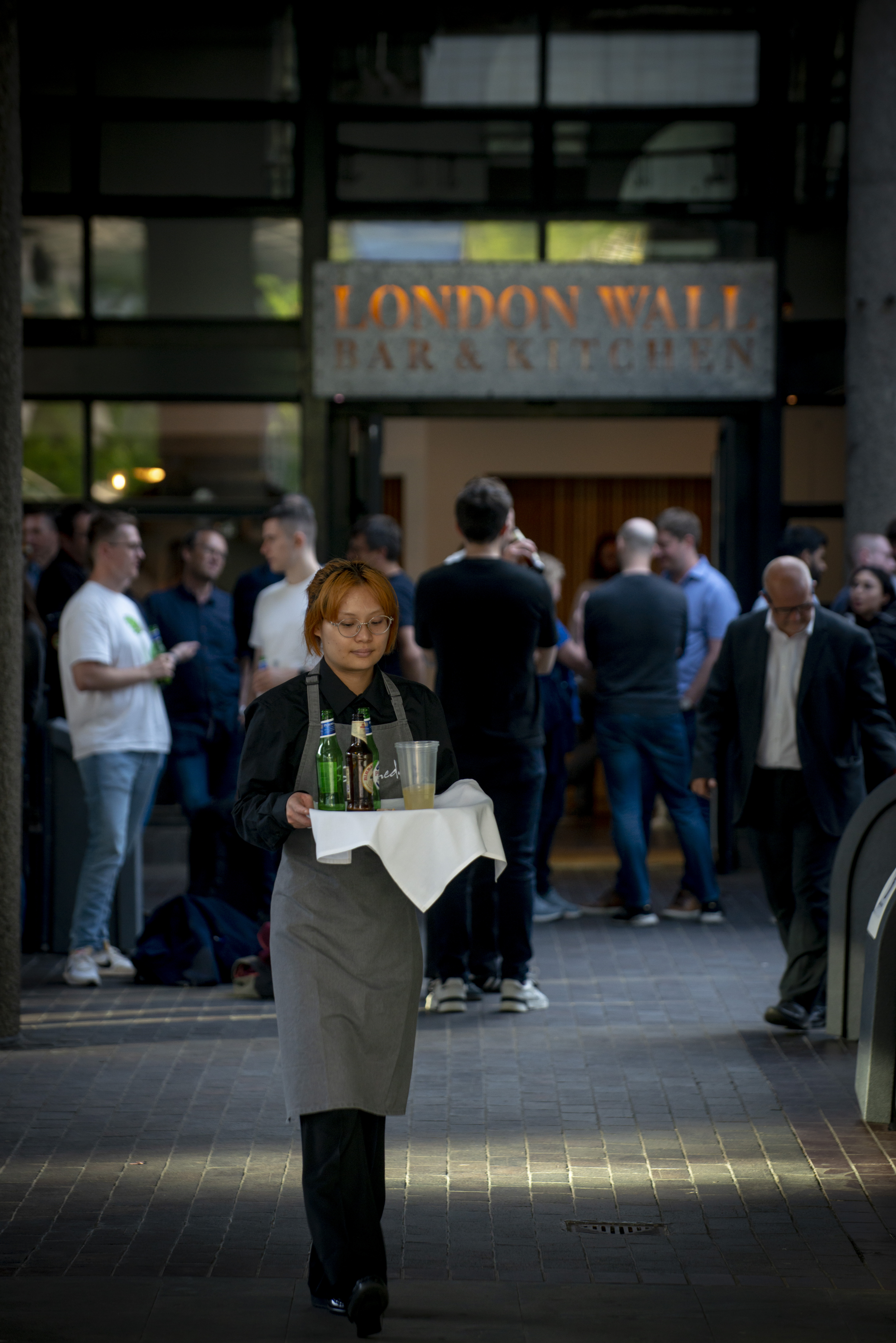 Networking event in Terrace Boardroom, London; casual attire, attentive service.